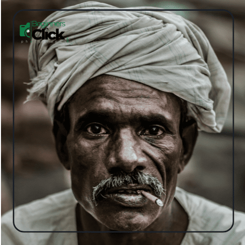 Portrait of an Elderly Man with a Cigarette Close-up portrait of an elderly man with a turban, mustache, and a cigarette, showcasing his deep expression.