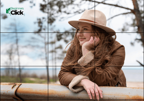 Rule of Thirds in Action: Balanced Storytelling Through Composition A woman in a black dress sits with a book in hand, positioned on the left third of the frame, next to a vase of flowers on the right.