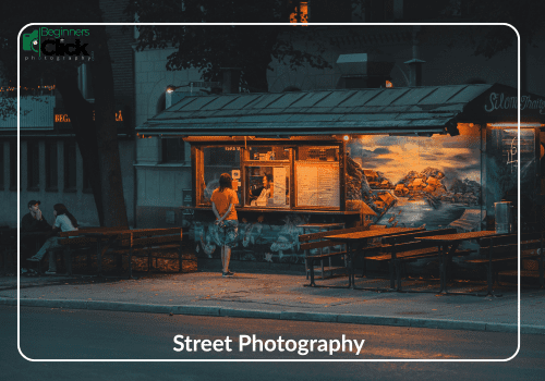 Evening Street Photography A warmly lit street food stand at dusk with a person standing in front of it, surrounded by benches and shadowy trees; overlaid text includes "Street Photography" and a label “ISO (5)”